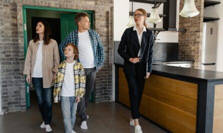 https://www.pexels.com/photo/a-real-estate-agent-touring-the-family-inside-a-house-7414931/